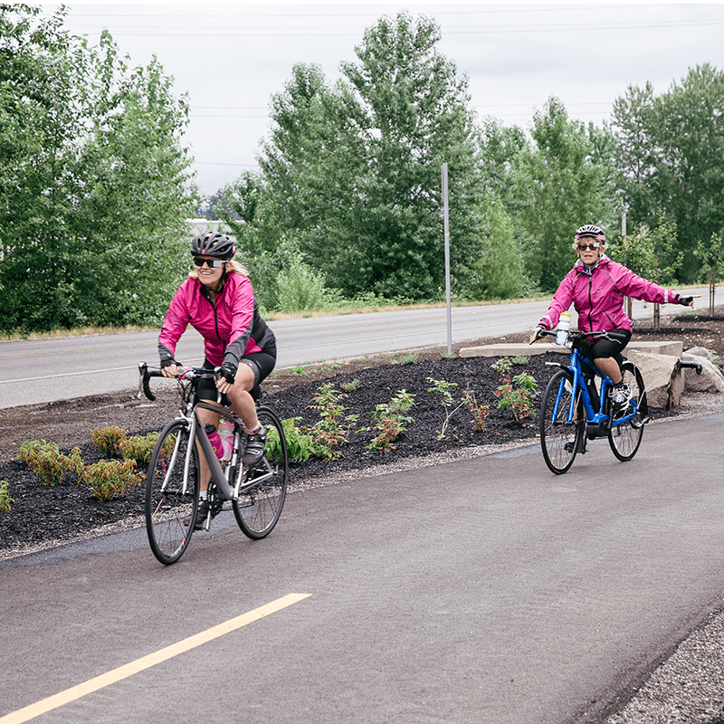 Couple of senior woman enjoying a bike ride